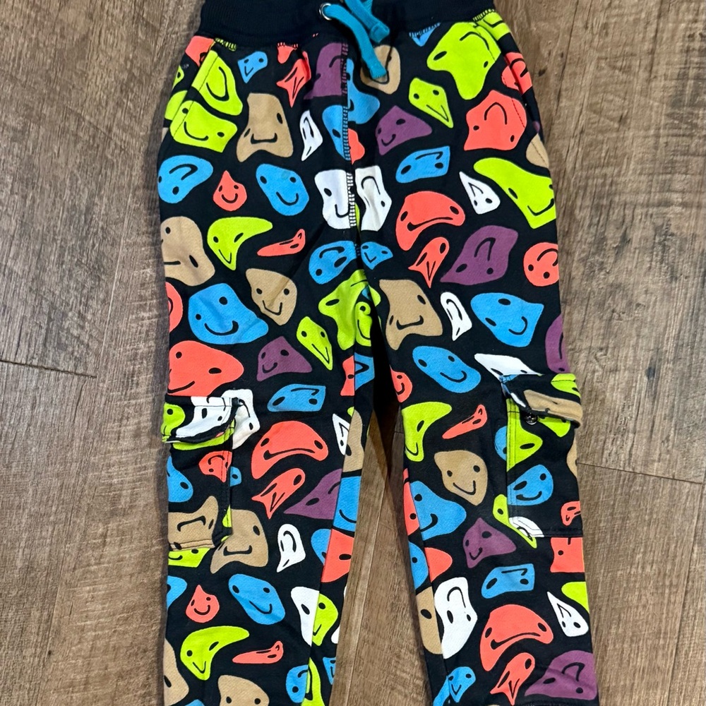 Kids Black Pajama Pants with Colorful Smiley Rock Print
